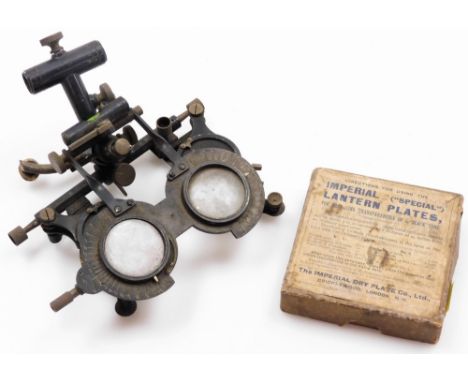 Unusual opticians optical viewing set, with various lenses in a metal framework 19cm high, and a coloured glass lantern slide