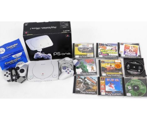A Playstation One console, controller and various games.