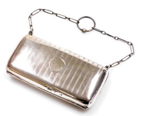 A George V silver evening purse, with chain handle, with part fitted interior, Birmingham 1917, 12cm wide, 3.4oz all in.