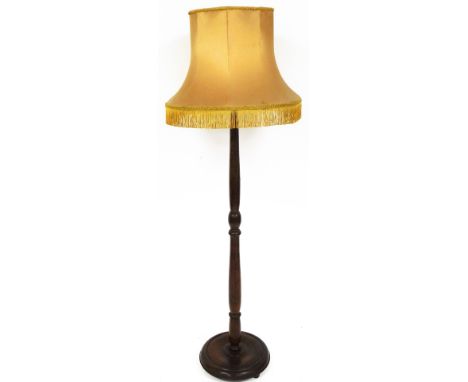 An oak standard lamp, on turned column with gold shade, 162cm high. 