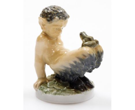 A Royal Copenhagen figure of Pan with a Toad, model 1713 and marked NBX, 12cm high.