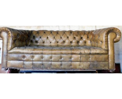 A green buttoned and studded leather Chesterfield sofa, 200cm wide.