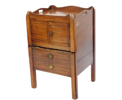 A George III mahogany night commode, with galleried top, pierced handles, front pot cupboard and two drawers, each with ring 