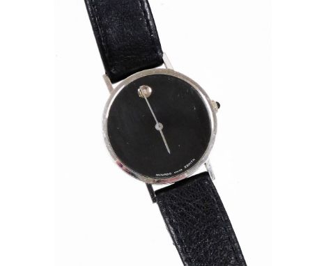 A Movado wristwatch, with circular watch face with blackened dial with tiny diamond set twelve point bezel, in a white metal 