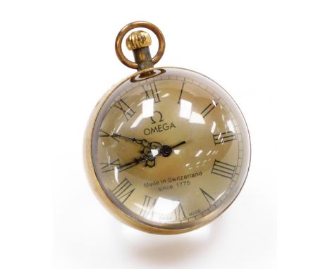 An Omega marked desk ball clock, with two rock crystal sides, on Omega silvered dial, with a seven jewel movement, bezel wind