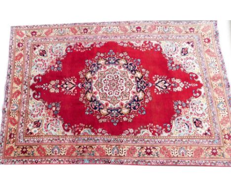 A vintage multicoloured Persian Tabriz rug, 280cm x 189cm.