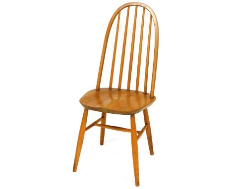A light elm Ercol style hoop back dining chair, with plain spindles, shaped seat and cylindrical legs joined by a H stretcher
