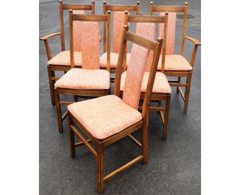 A set of eight light elm Ercol dining chairs, in a light beech and elm with pink floral decoration. 