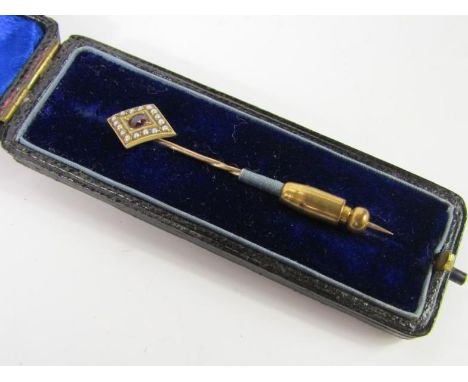 An amethyst and seed pearl set tie pin, in a lozenge design, yellow metal, marked 15ct, 1.8g, boxed.