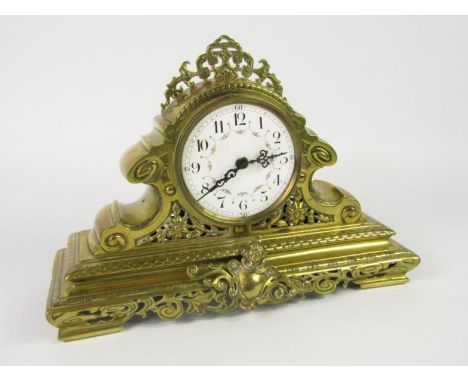 A French brass cased mantel clock, enamel dial bearing Arabic numerals, painted with floral swags, modern battery operated mo