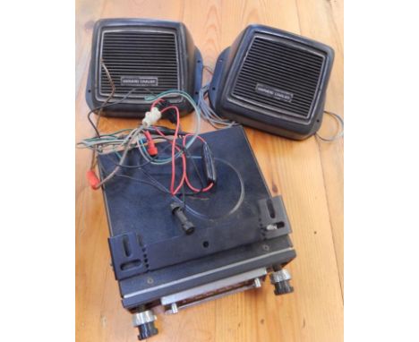A Ford Cortina Crown eight track cassette player, with speaker and cassettes.
