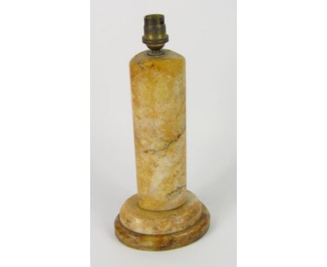 A yellow marble table lamp, of oval cylindrical form, on a stepped base, 31cm high.