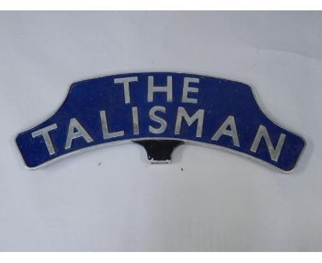 A cast metal and enamel replica train headboard The Talisman, signed verso by the driver and fireman, 90cm long.