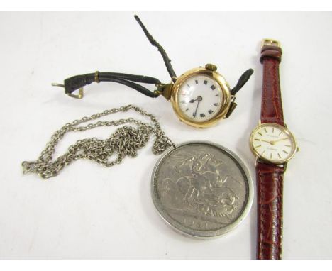 A Tissot lady's 9ct gold circular cased wristwatch, back plate presentation engraved, on a leather strap, further yellow meta