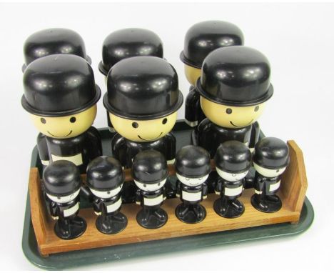 Six Spillers Homepride plastic character storage jars, and six spice jars in a pine rack.