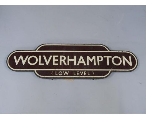 A Wolverhampton cast iron and brown enamel station name plate, low level, 92.5cm long.