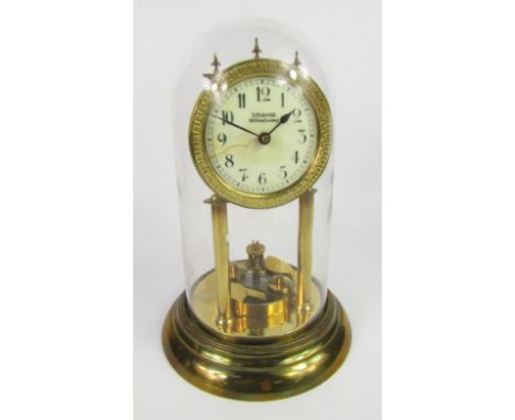 An S Fisher Ltd brass four hundred day anniversary clock, enamel dial bearing Arabic numerals, with a glass dome, 30cm high.