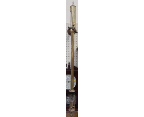 A 20thC gilt brass marine stick barometer, and gimble.