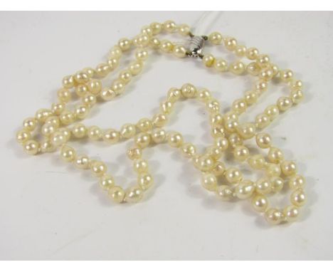 A baroque cultured pearl double strand necklace, on a white metal clasp, marked 925.