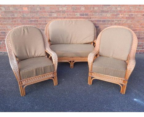 A cane conservatory suite, comprising a two seater sofa and a pair of armchairs, (3).
