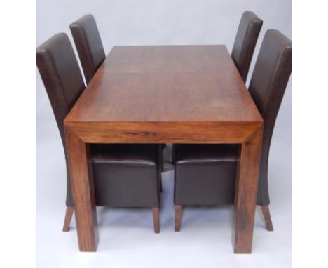 A hardwood extending dining table, on square section legs, 150cm wide enclosed. and four matching dining chairs. 