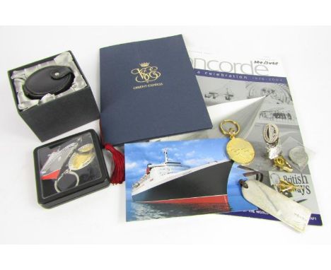 Travel interest, a Concorde silver luggage tag alarm clock and gilt metal, lapel badge, and commemorative brochure 2003, Orie