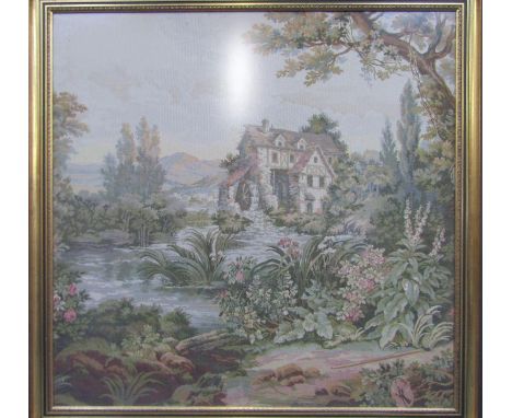 A woolwork tapestry of a watermill in a landscape, framed, 98cm x 100cm.