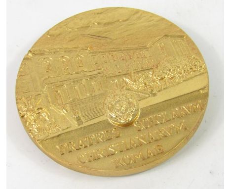 A De La Salle gilt metal medal, awarded by The Institute of The Brothers of The Christian Schools to Mrs Hazel Heaton Armstro