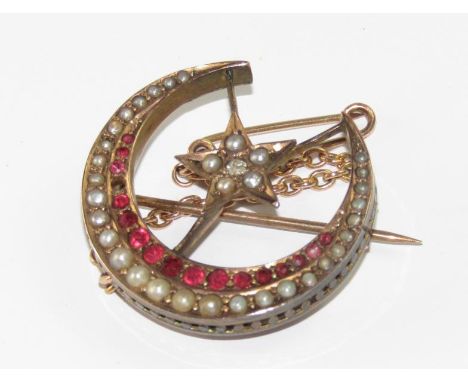 A late Victorian 9ct gold crescent brooch, set with graduated seed pearls and spinnels, and five point star within, also set 