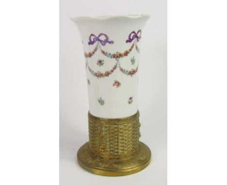 A Continental porcelain vase, decorated with flowers, mounted in a brass stand, converted to a table lamp, with a cream shade