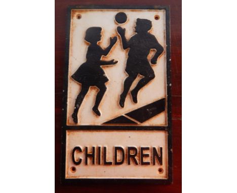 A cast iron Children Playing sign, 30.5cm x 18.5cm.
