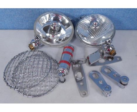 Two Lucas automobile spot lights, with chrome grills, and a collection of bumper attachment brackets etc. (contents of 2 boxe