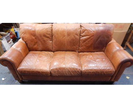 A tan leather three seater sofa, 202cm long.