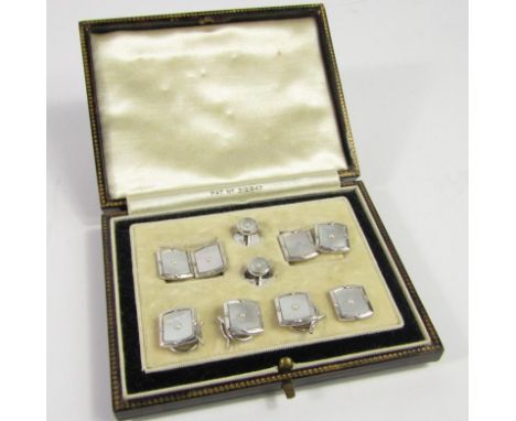 A suite of gentleman's white metal mother of pearl and seed pearl dress jewellery, comprising a pair of double link cuff link