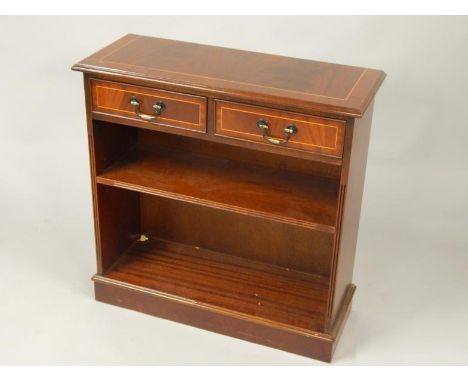 A mahogany finish open bookcase, the overhanging moulded top raised above two frieze drawers and one adjustable shelf on a bl