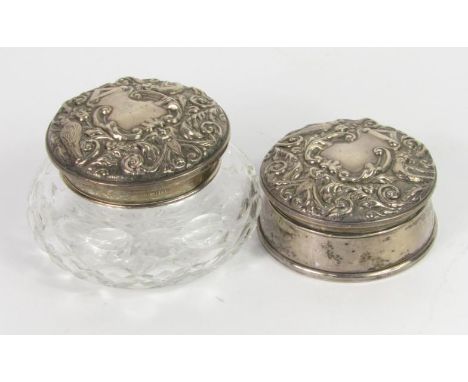 A matched Elizabeth II silver part dressing table set, to include hairbrush, comb, hand mirror 22cm high, lidded jar, pin dis