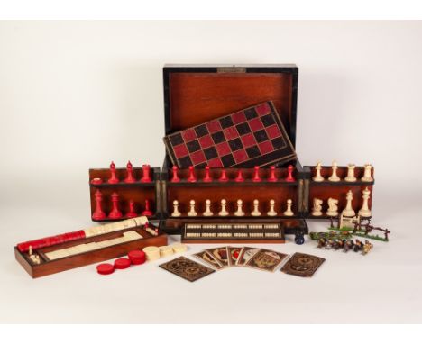 A VICTORIAN COROMANDEL WOOD GAMES COMPENDIUM with natural and red stained ivory CHESS SET (one piece deficient), CONFORMING D