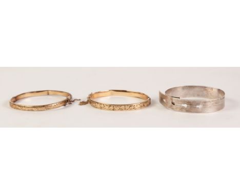 ENGINE TURNED SILVER BELT PATTERN BANGLE with wrap-over adjustment, Chester 1943 and TWO ENGRAVED 9ct GOLD AND METAL FILLED H