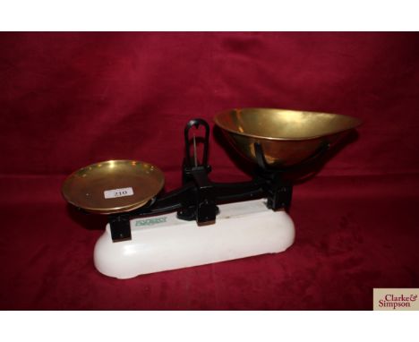 A set of cast iron shop scales by W T Avery to weigh 2lbs with brass weight tray and brass scoop
