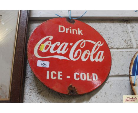 A circular enamel advertising sign for "Coca-Cola" 12" dia.