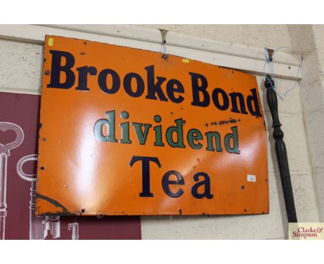 An enamel advertising sign for "Brook Bond Dividend Tea", 20" x 30"