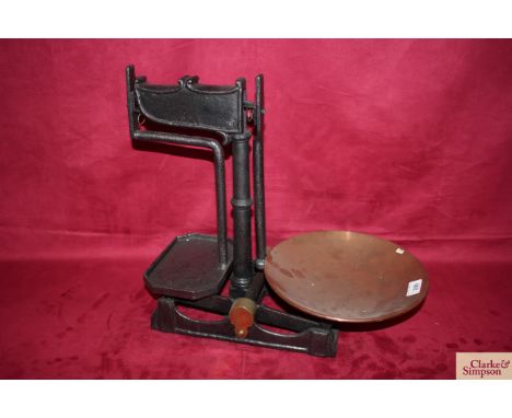 A set of cast iron platform shop scales with copper tray