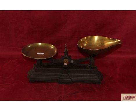 A set of cast iron and brass scales by Parnell &amp; Sons of Bristol to weigh 10lbs with brass tray and brass scoop