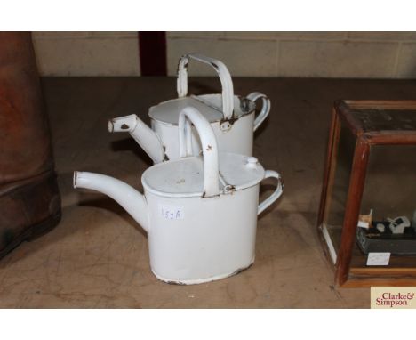 Two enamel country house water cans