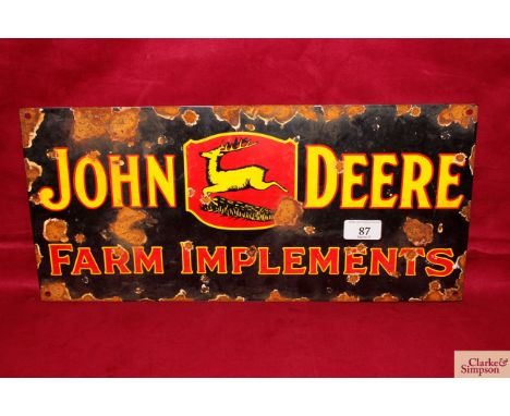 An enamel "John Deere Farm Implements" advertising sign 8½" x 17½"