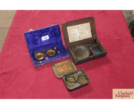 Three sets of jewellers balance scales