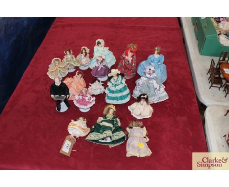 A quantity of dolls house dolls of ladies, butler and various children and a dressed Teddy bear