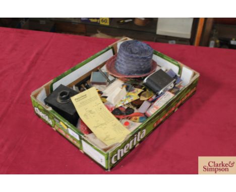 A box containing various puzzle and magic trick items, old pens etc. 