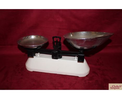 A small set of shop scales with stainless steel weight tray and scoop
