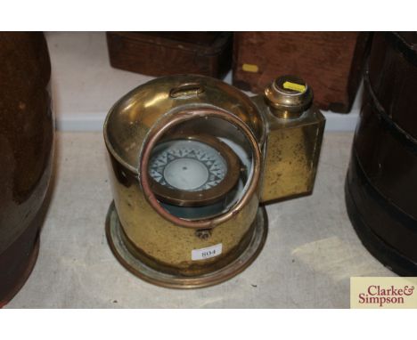 A brass cased ships magnetic compass in binnacle 10" high